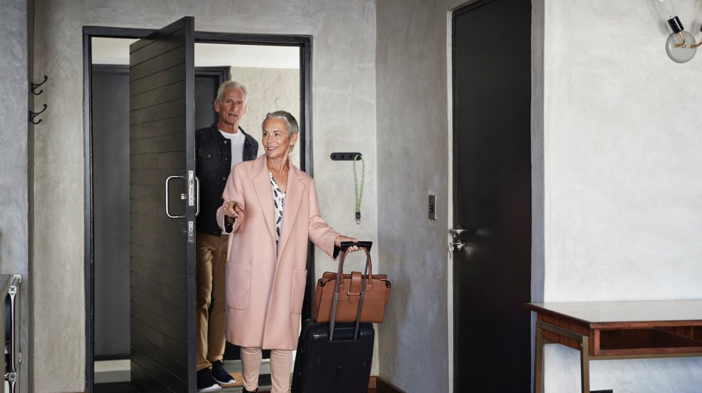 Couple arriving in their hotel room